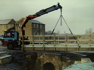 Transportation and installation of bridge at Whitley Willows, Lepton